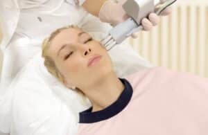 Woman closes eyes during fractional resurfacing in Chevy Chase.